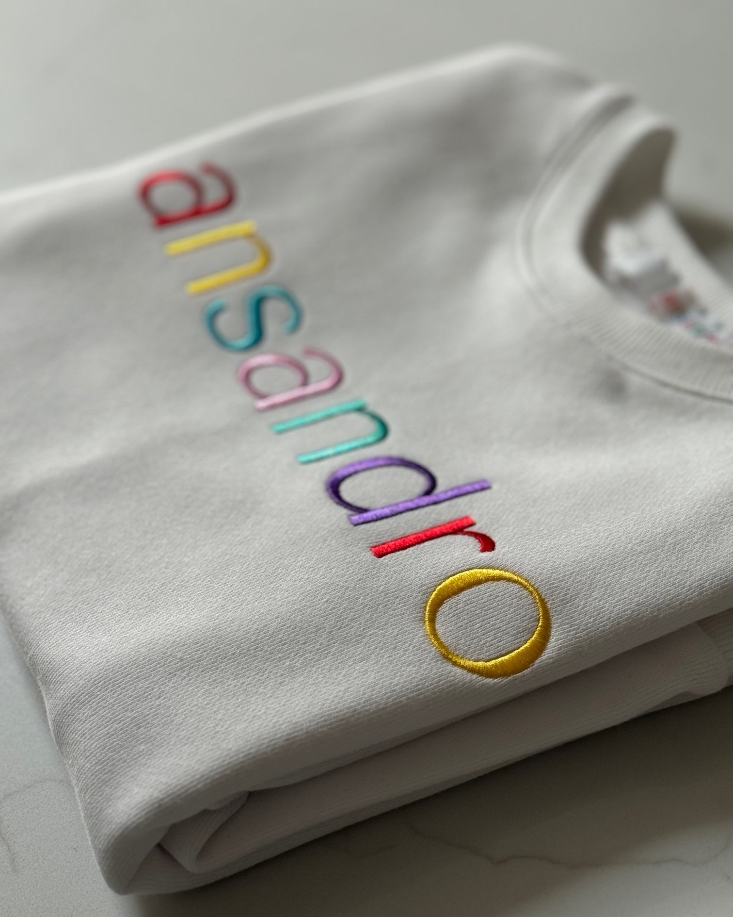 100% cotton lightweight sweatshirt with embroidery - stylish kids' activewear - close up branding