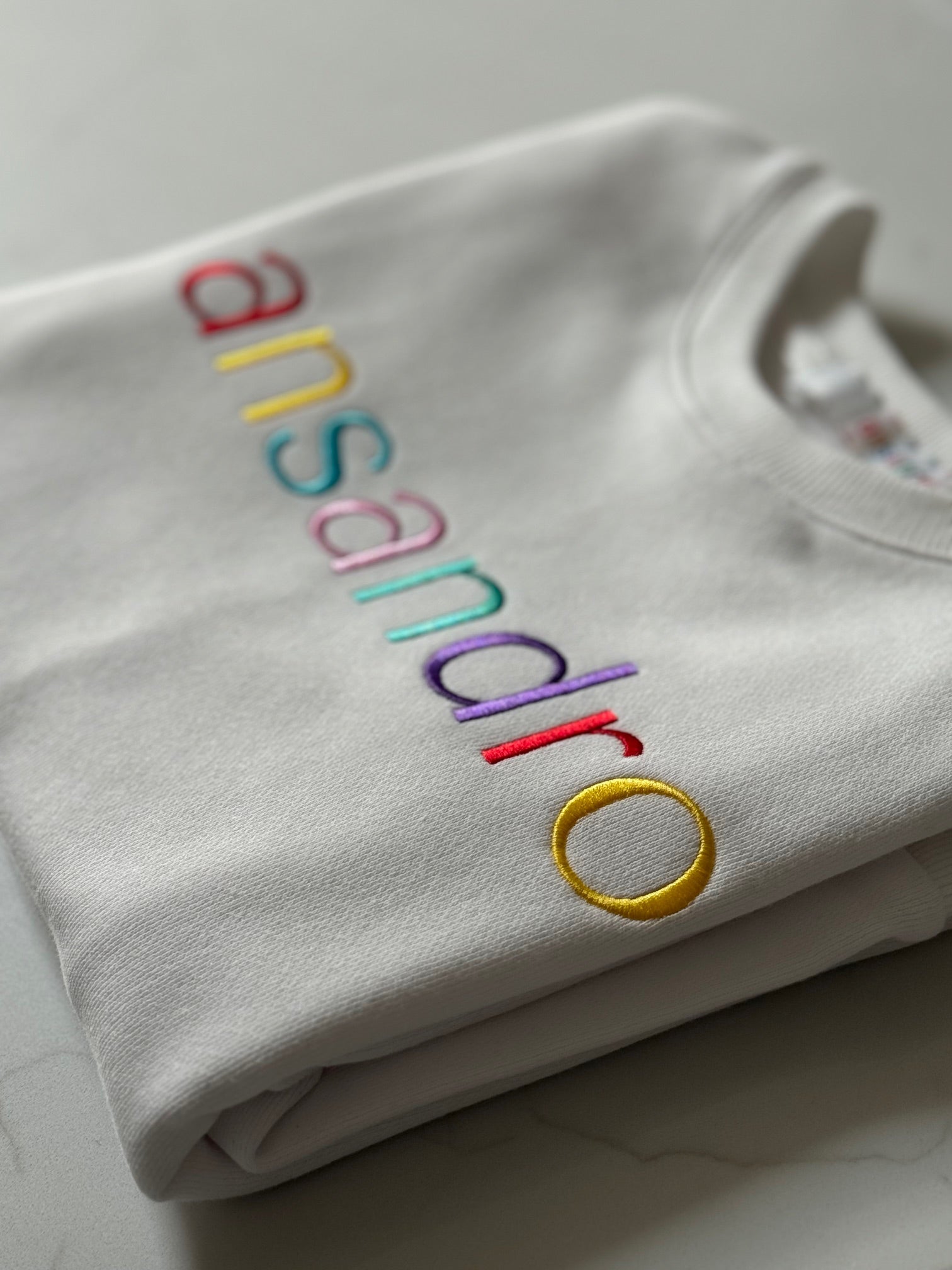 100% cotton lightweight sweatshirt with embroidery - stylish kids' activewear - close up branding