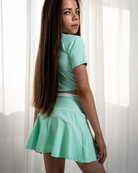 Side view of mint girls activewear skort set