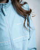Powder blue windbreaker jacket with Ansandro branding