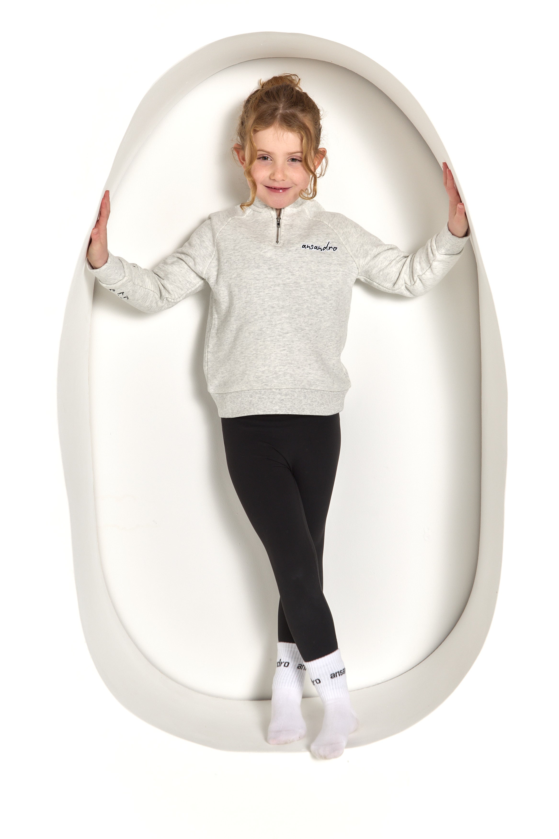 100% cotton kids' sweatshirt with zip - premium quality and style - paired with girls black high-waisted leggings and branded socks