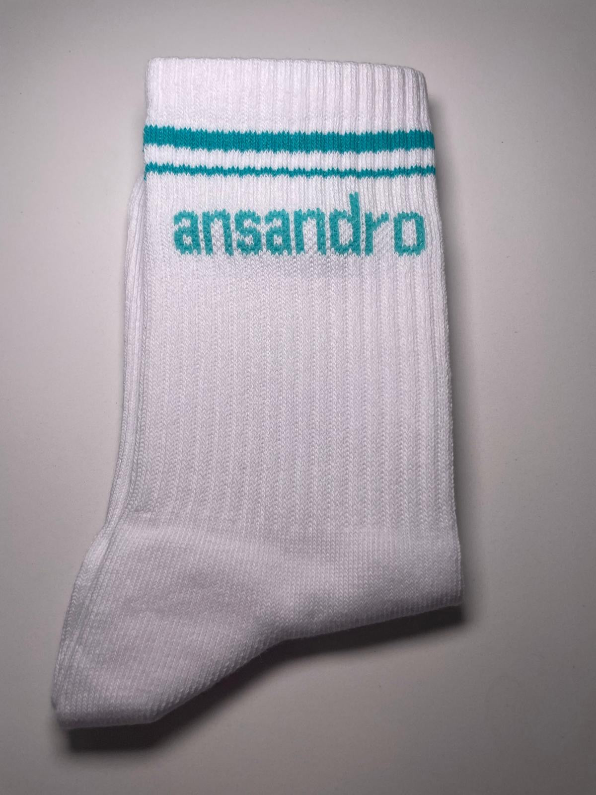 100% cotton branded socks for kids - soft, breathable, and durable design. Teal text and teal banding